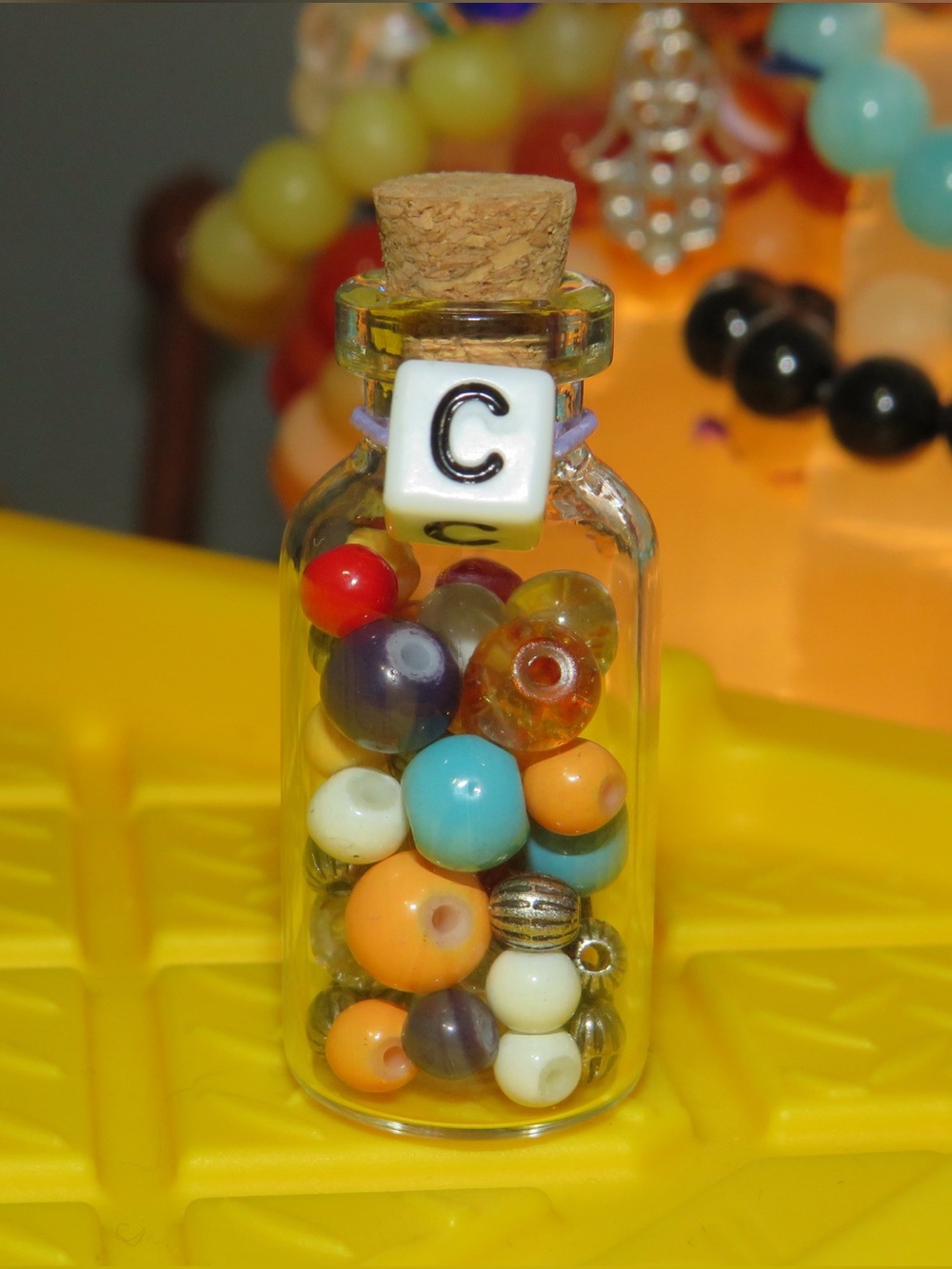 Initial C potion bottle